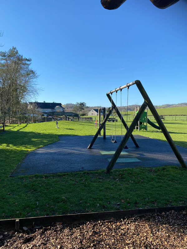 The  junior swings on Millennium Playing Field Playground